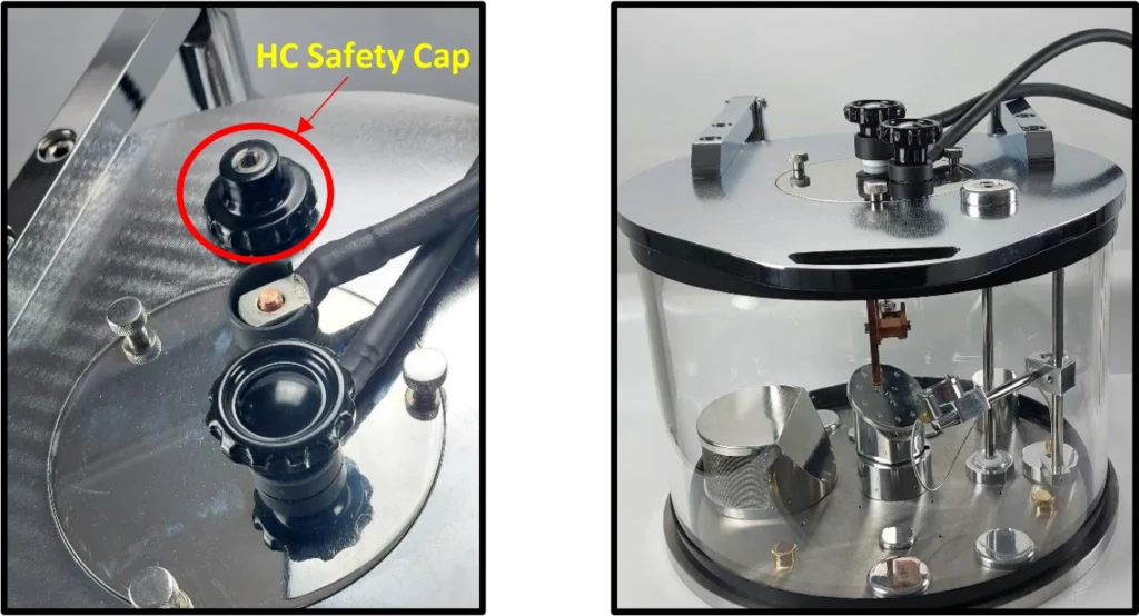 Safety caps for the high-current feedthroughs on the chamber lid.