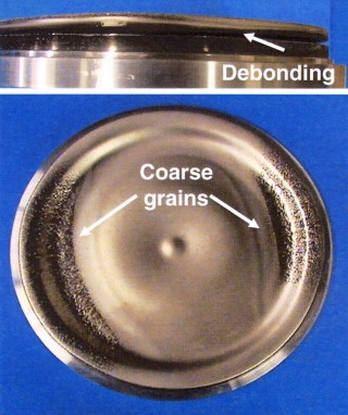 Partial debonding at the target-backing plate interface and the resulting coarse grains.